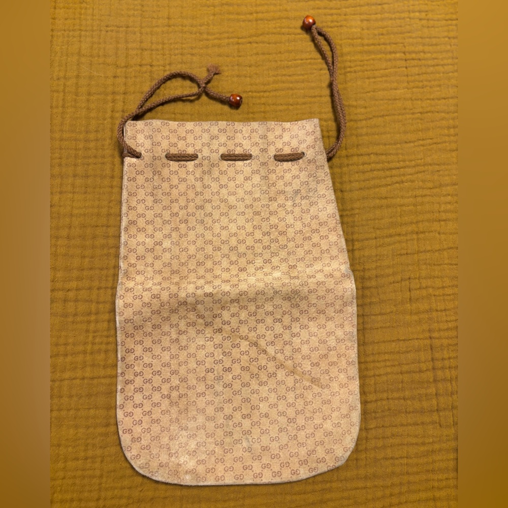 Vintage GUCCI Monogram leather drawstring bag.‎